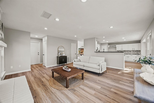 living room with light hardwood / wood-style flooring