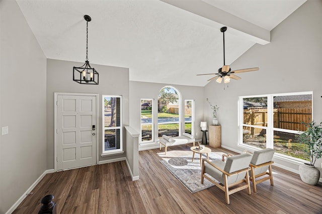 entrance foyer featuring beamed ceiling, high vaulted ceiling, wood-type flooring, and ceiling fan with notable chandelier