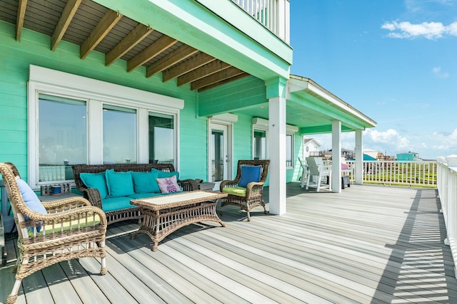 wooden terrace featuring an outdoor living space