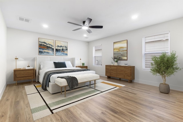 bedroom featuring light hardwood / wood-style floors and ceiling fan