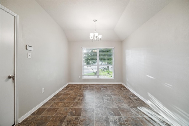 spare room featuring lofted ceiling and a notable chandelier