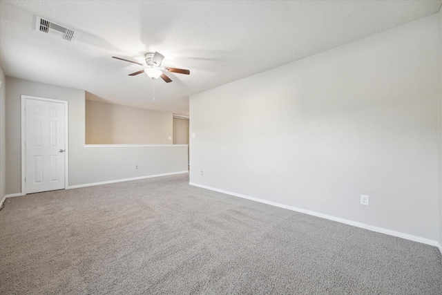 spare room with ceiling fan and carpet floors