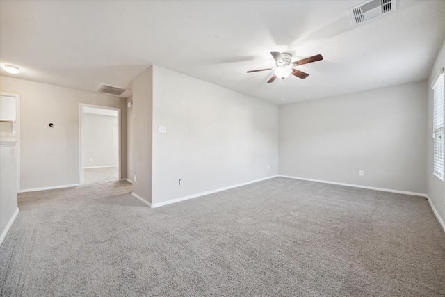 carpeted empty room with ceiling fan