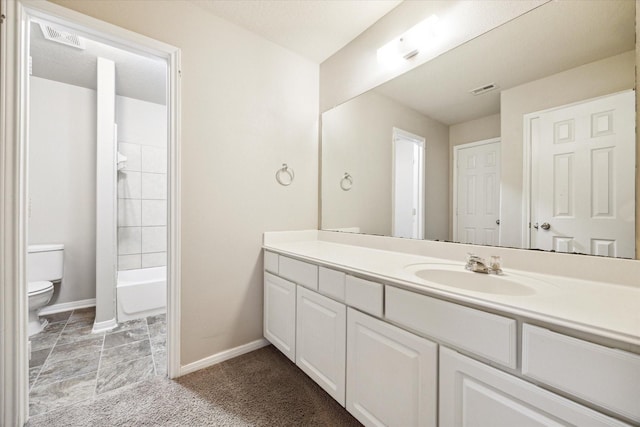 full bathroom featuring vanity, toilet, and tiled shower / bath combo