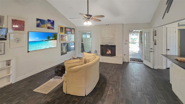 living room with a fireplace, dark hardwood / wood-style floors, vaulted ceiling, and ceiling fan