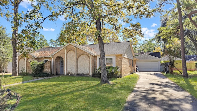 ranch-style house featuring a front lawn and a garage