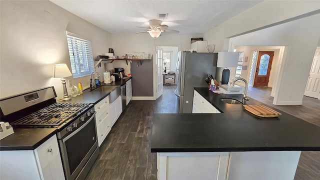 kitchen with white cabinetry, dark hardwood / wood-style flooring, stainless steel appliances, and sink