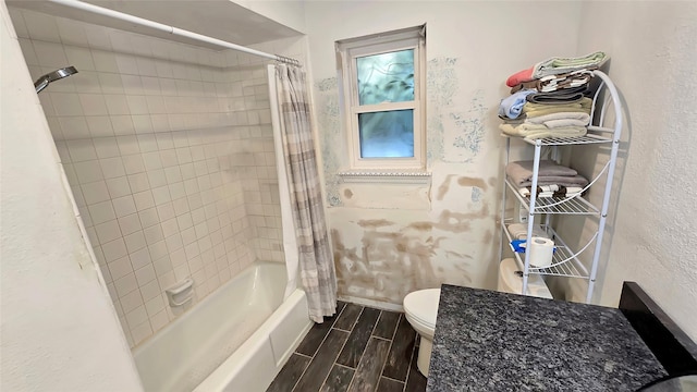 bathroom with toilet and shower / tub combo with curtain