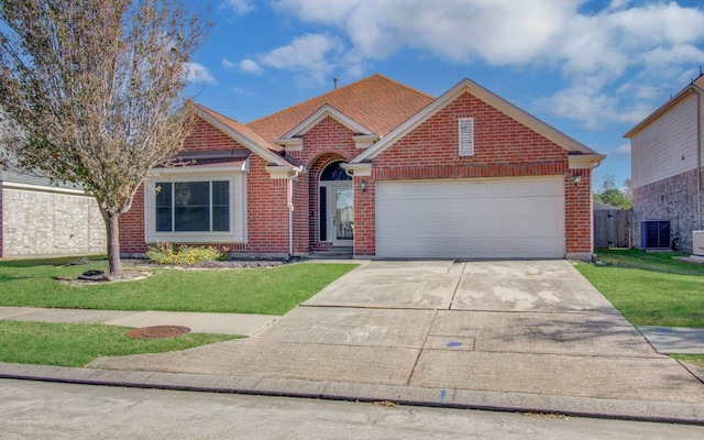 view of front facade with central AC, a front yard, and a garage