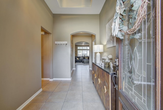 corridor with light tile patterned floors