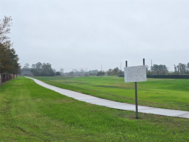 view of home's community featuring a lawn