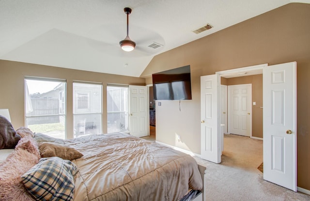 bedroom with light carpet, vaulted ceiling, and ceiling fan