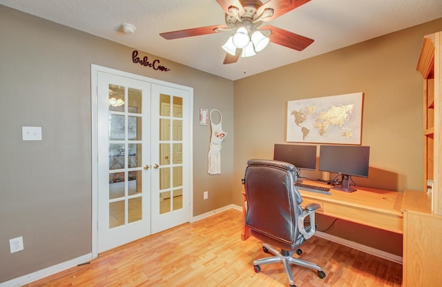 office area with ceiling fan, french doors, a textured ceiling, and light wood-type flooring