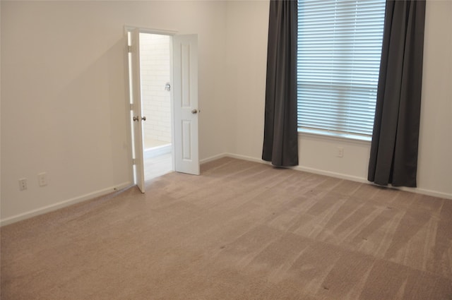 carpeted empty room with plenty of natural light