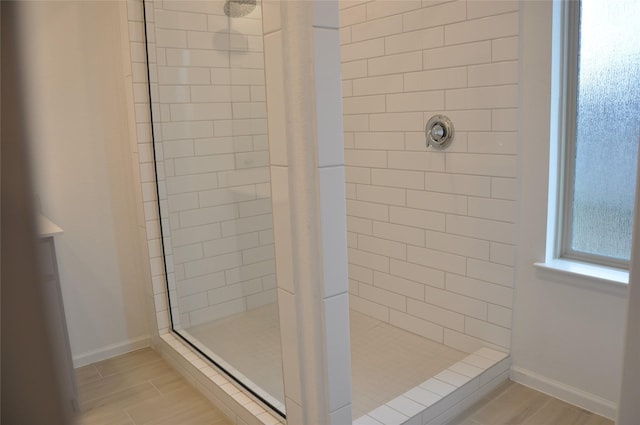 bathroom featuring tiled shower