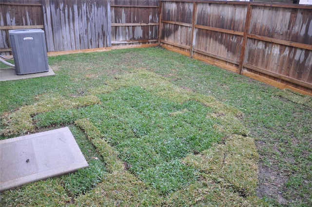 view of yard featuring central AC unit