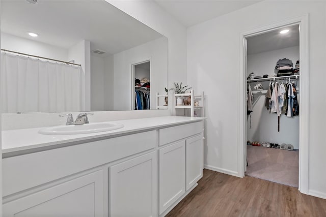 bathroom featuring vanity and wood-type flooring