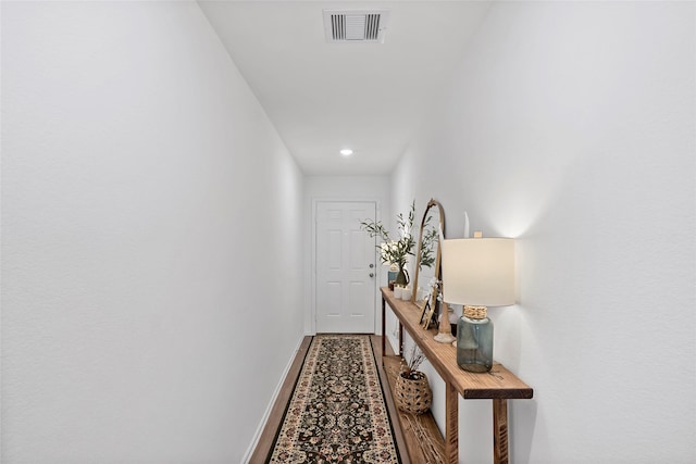 hallway featuring hardwood / wood-style flooring