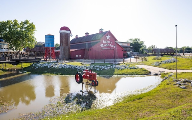 view of community with a water view