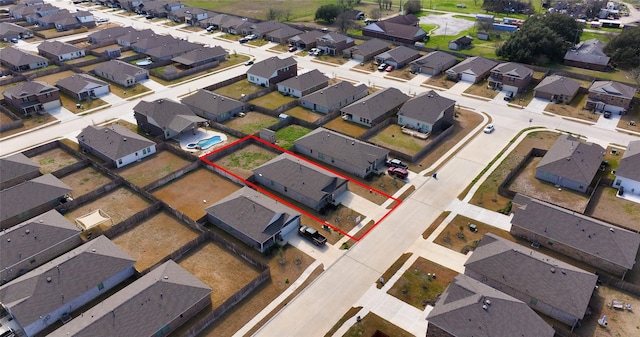 birds eye view of property with a residential view