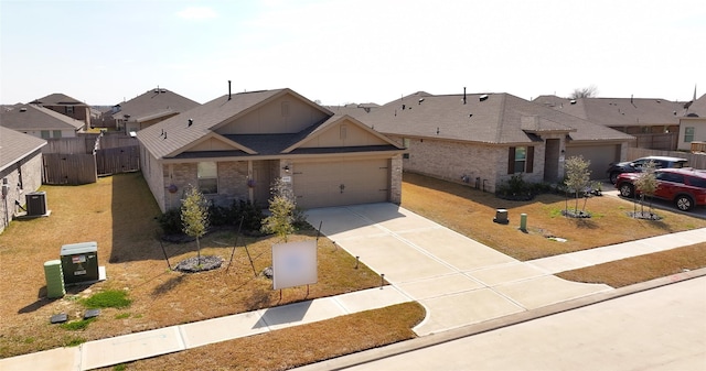 view of front of property with brick siding, a residential view, central AC unit, a garage, and driveway