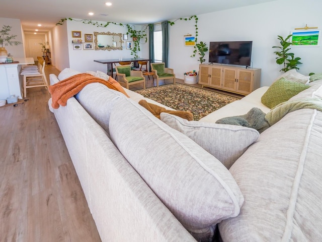 living room featuring recessed lighting and wood finished floors