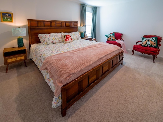 bedroom featuring light colored carpet