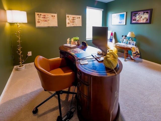 carpeted office featuring baseboards