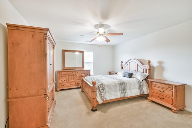 bedroom with ceiling fan and light colored carpet