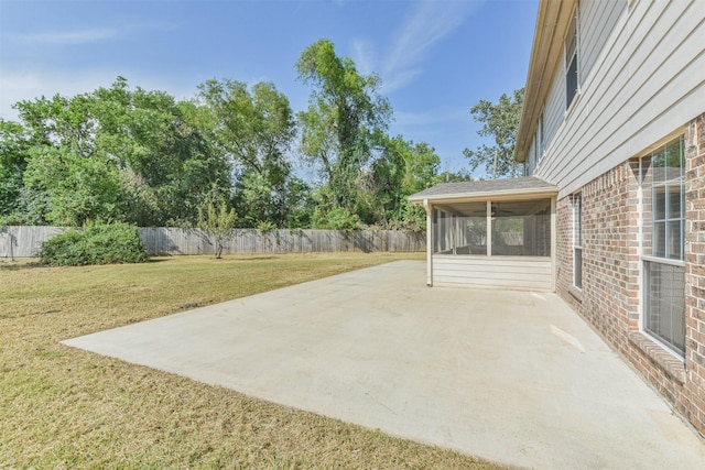 view of patio featuring a sunroom