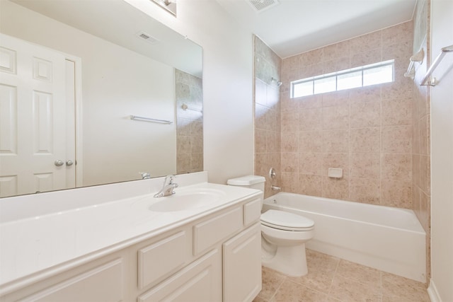 full bathroom with vanity, tile patterned floors, toilet, and tiled shower / bath