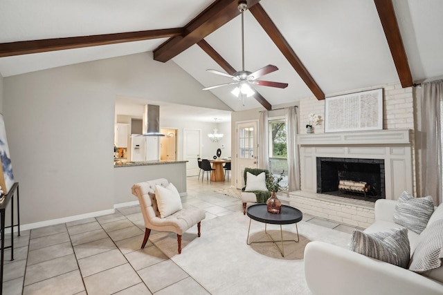 living room featuring a brick fireplace, beamed ceiling, high vaulted ceiling, light tile patterned floors, and ceiling fan with notable chandelier