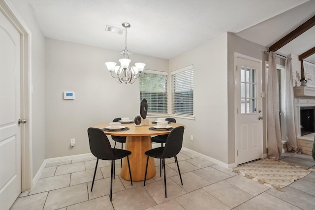 dining space with vaulted ceiling with beams, light tile patterned flooring, and a chandelier