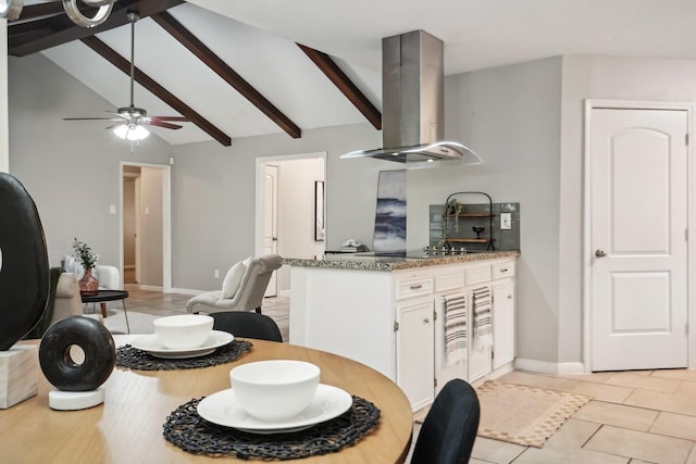 kitchen featuring white cabinets, vaulted ceiling with beams, light stone counters, and exhaust hood