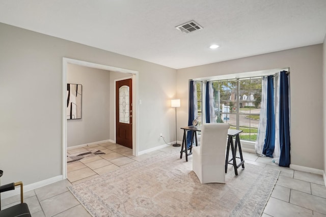 entrance foyer featuring light tile patterned floors