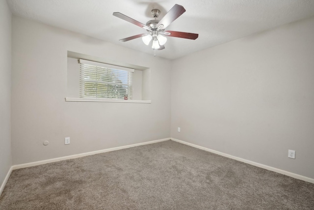 spare room with carpet flooring and ceiling fan