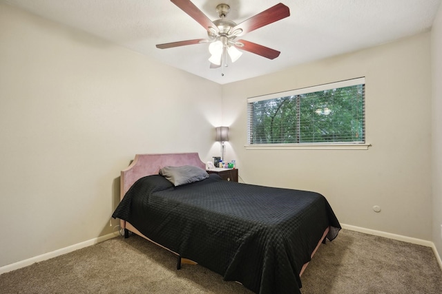 bedroom with ceiling fan and carpet floors