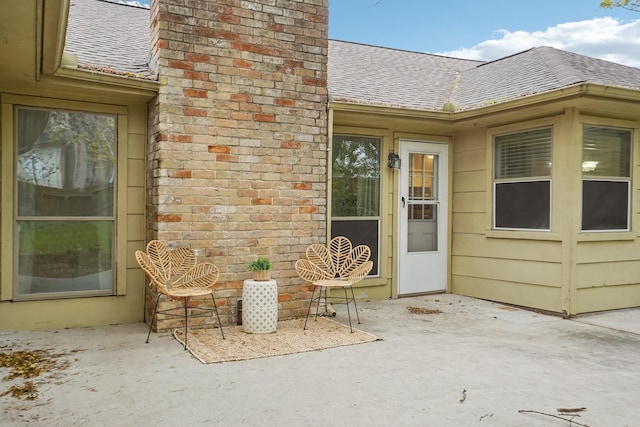 property entrance with a patio area