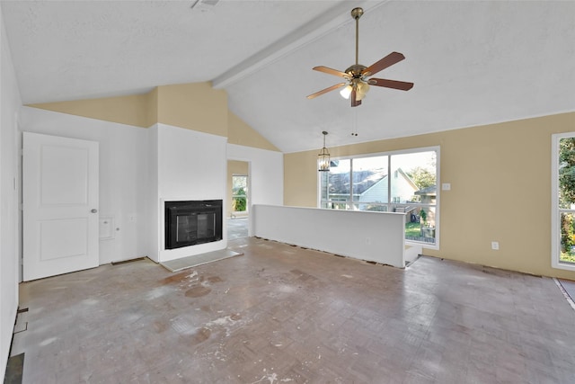 unfurnished living room featuring beamed ceiling, ceiling fan with notable chandelier, a textured ceiling, and high vaulted ceiling