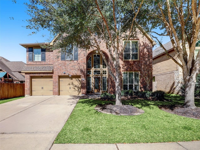 view of front of home featuring a front yard and a garage