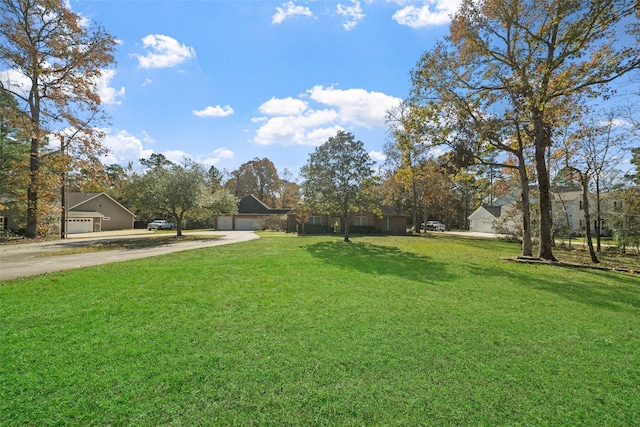 view of yard featuring a garage