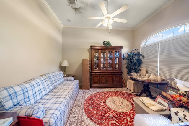 living area featuring crown molding and ceiling fan