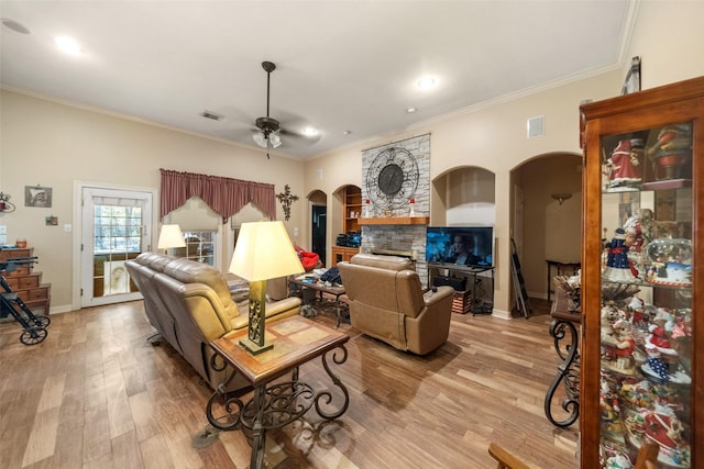 living room with ceiling fan, light hardwood / wood-style floors, and ornamental molding