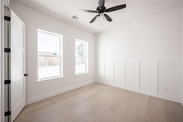 empty room featuring light hardwood / wood-style floors and ceiling fan