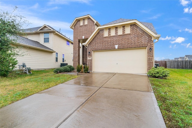 traditional-style house with driveway, an attached garage, fence, a front lawn, and brick siding