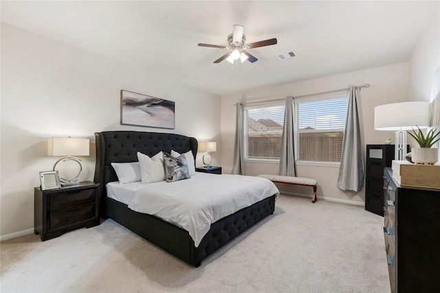 bedroom featuring light carpet, baseboards, and visible vents