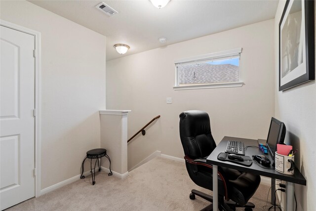 office area with baseboards, visible vents, and carpet flooring