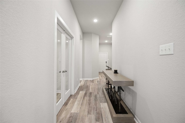 corridor featuring light hardwood / wood-style flooring