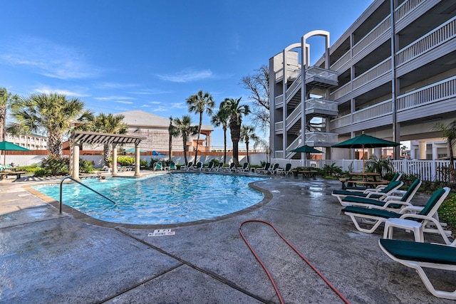 view of swimming pool with a pergola and a patio