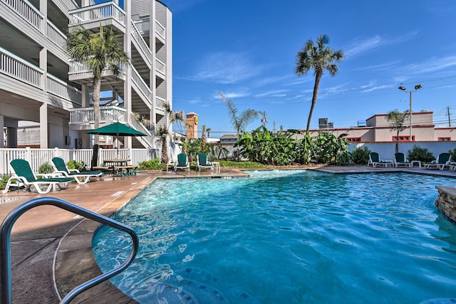 view of swimming pool with a patio area